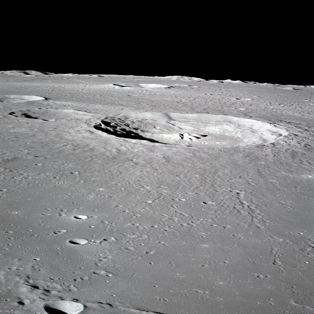 NASA image: Apollo 16 Mission image - 70mm handheld camera view of the moon featuring the Bullialdus Crater.