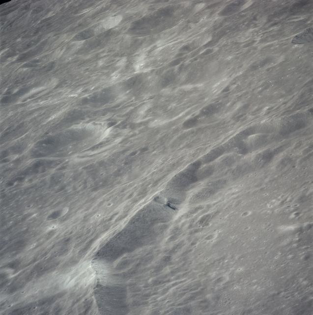 Oblique view of rim of Guyot crater on lunar farside as seen by Apollo 16