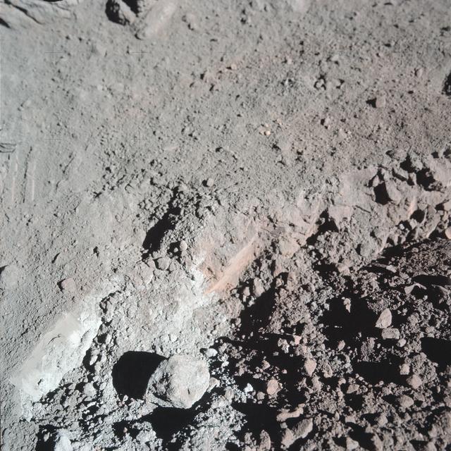 NASA image: View of the orange soil which Apollo 17 crewmen found at Station 4 during EVA