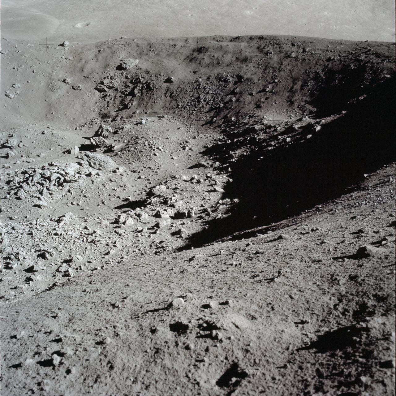 AS17-137-20992 (12 Dec. 1972) --- A view looking into Shorty Crater, taken at Station 4, showing the orange soil. Astronaut Harrison H. Schmitt found the orange soil on the moon during the second Apollo 17 extravehicular activity (EVA) at the Taurus-Littrow landing site. While astronauts Eugene A. Cernan, commander, and Schmitt, lunar module pilot, descended in the Lunar Module (LM) "Challenger" to explore the Taurus-Littrow region of the moon, astronaut Ronald E. Evans, command module pilot, remained with the Command and Service Modules (CSM) "America" in lunar orbit.