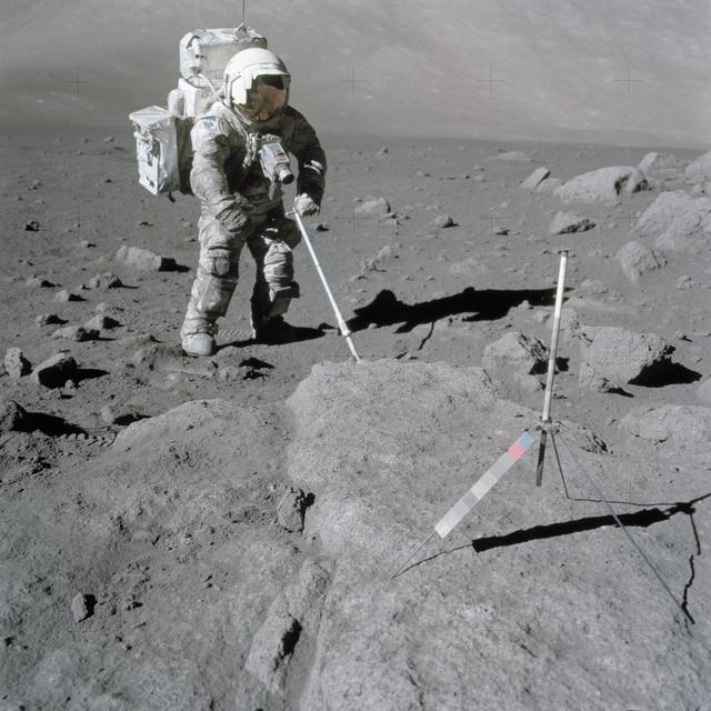 NASA image: Astronaut Harrison Schmitt uses scoop to retrieve lunar samples during EVA