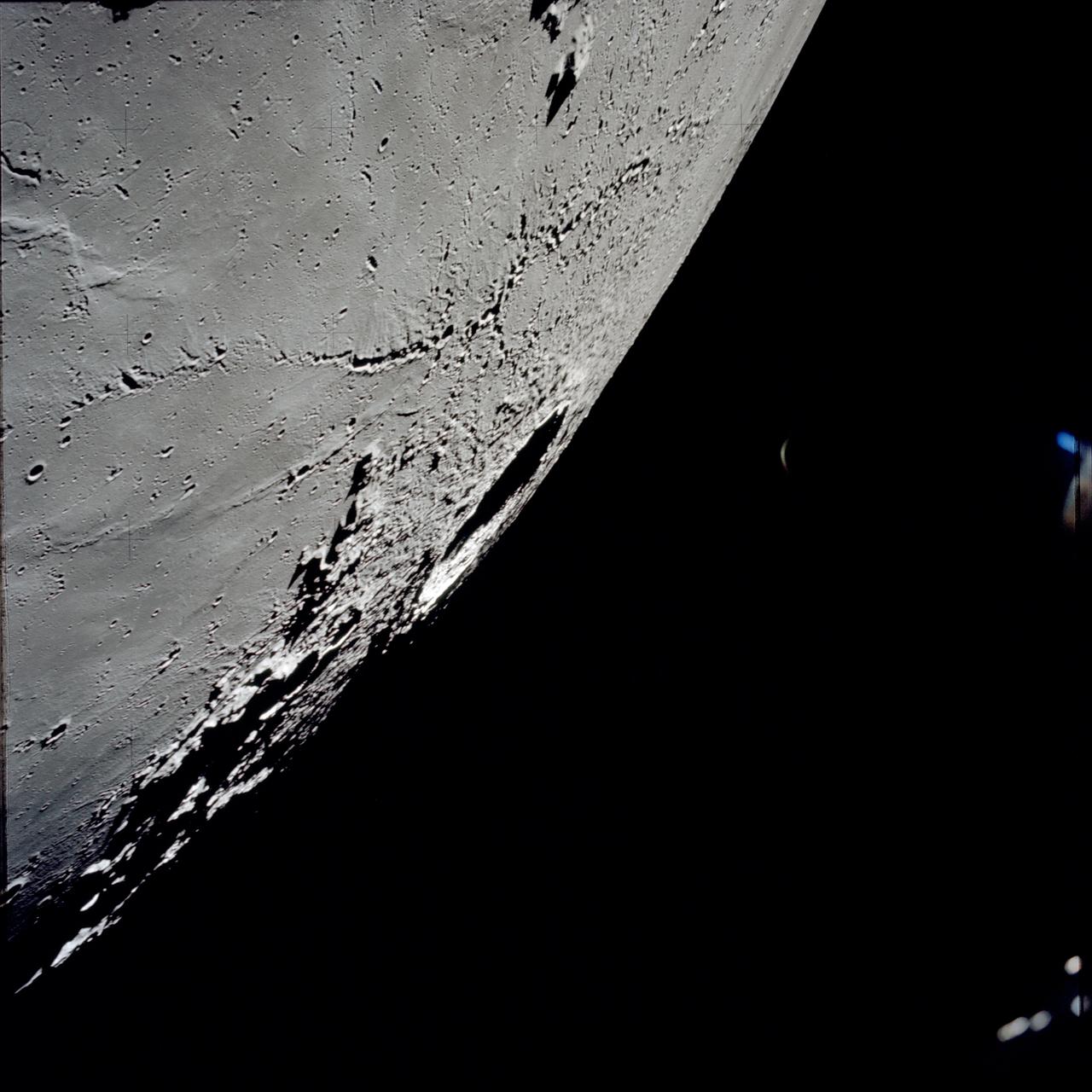 AS17-145-22287 (7-19 Dec. 1972) --- An oblique view of the large crater Copernicus on the lunar nearside, as photographed from the Apollo 17 spacecraft in lunar orbit. This view is looking generally southwest toward the crater on the horizon. The coordinates of the center of Copernicus are approximately 20 degrees west longitude and 9.5 degrees north latitude.