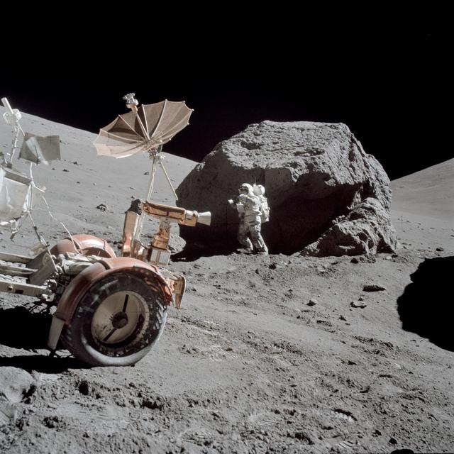 NASA image: Astronaut Harrison Schmitt standing next to boulder during third EVA