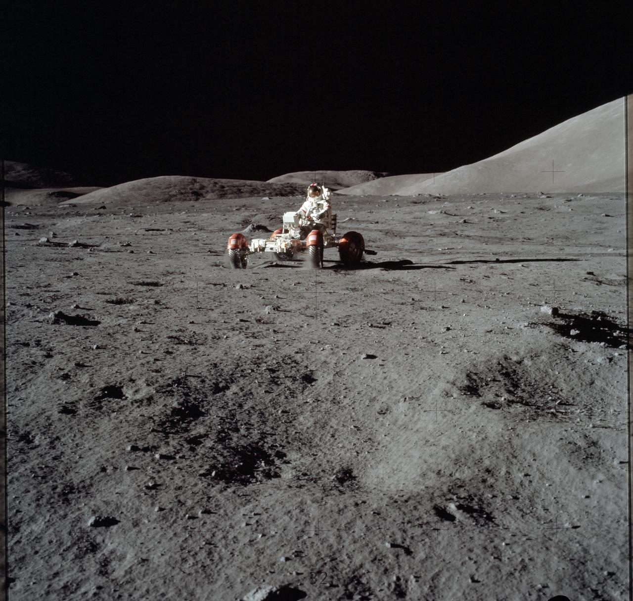AS17-147-22523 (11 Dec. 1972) --- Astronaut Eugene A. Cernan is seen test driving the "stripped down" Lunar Rover Vehicle (LRV) prior to loading the LRV up. Equipment later loaded onto the LRV included the ground controlled television assembly, the lunar communications relay unit, the hi-gain antenna, the low-gain antenna, aft tool pallet, and lunar tools and scientific gear.