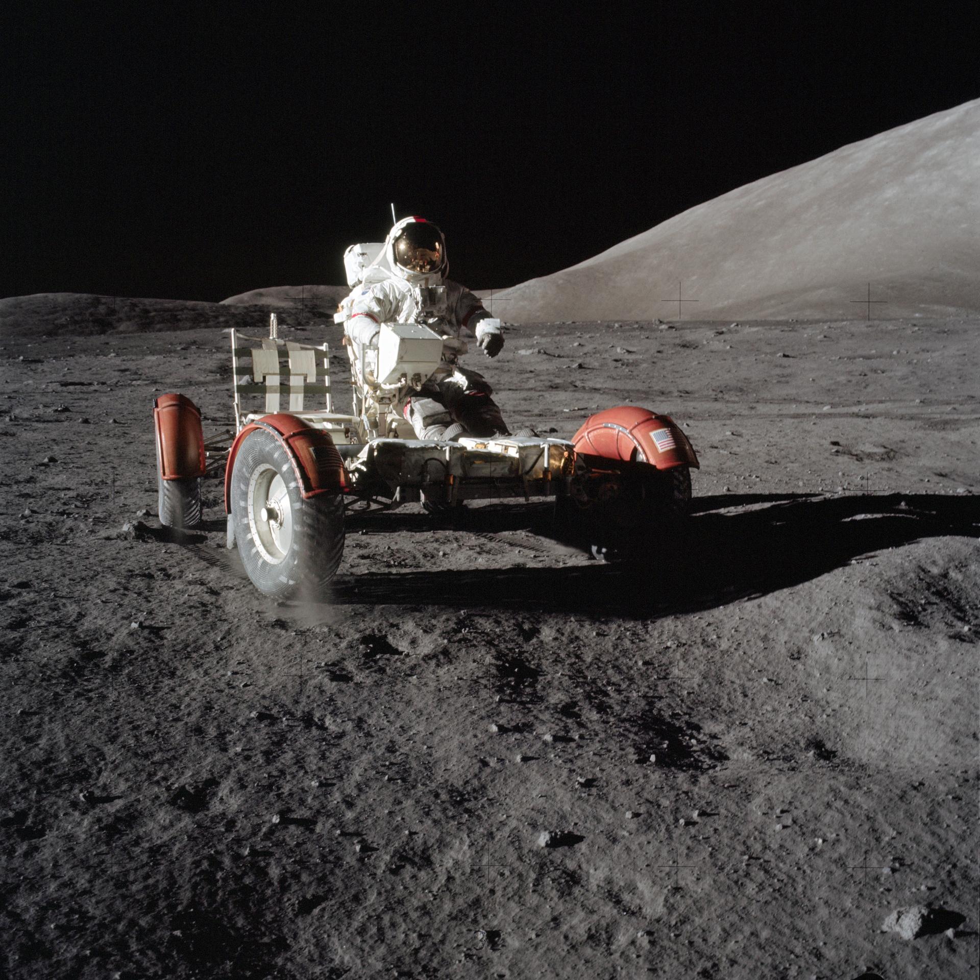 Apollo 17 astronaut Gene Cernan drives the lunar rover on the Moon in 1972