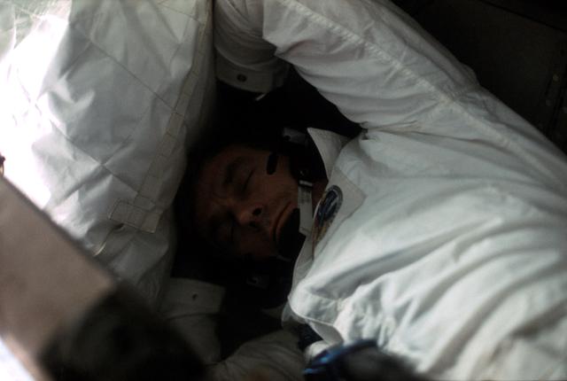 Astronaut Eugene Cernan sleeping aboard Apollo 17 spacecraft