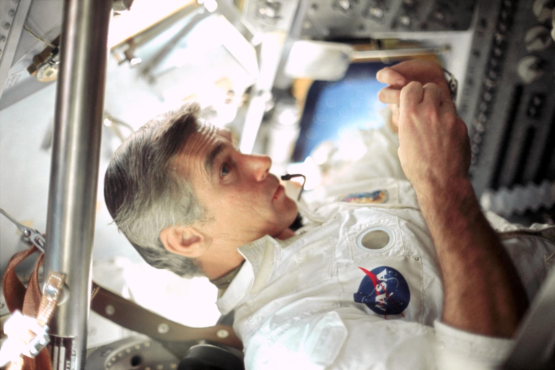 Gene Cernan is seen in the Apollo 17 spacecraft during their flight.