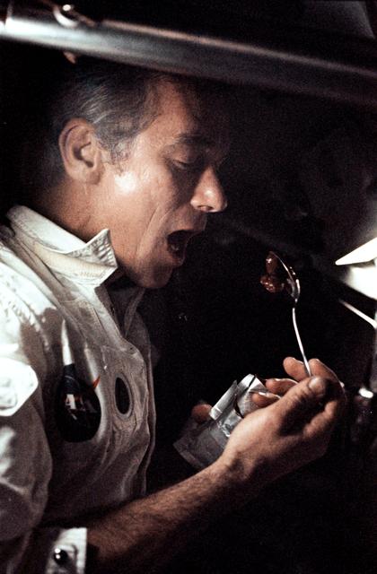 NASA image: Astronaut Eugene Cernan eating a meal aboard Apollo 17 spacecraft