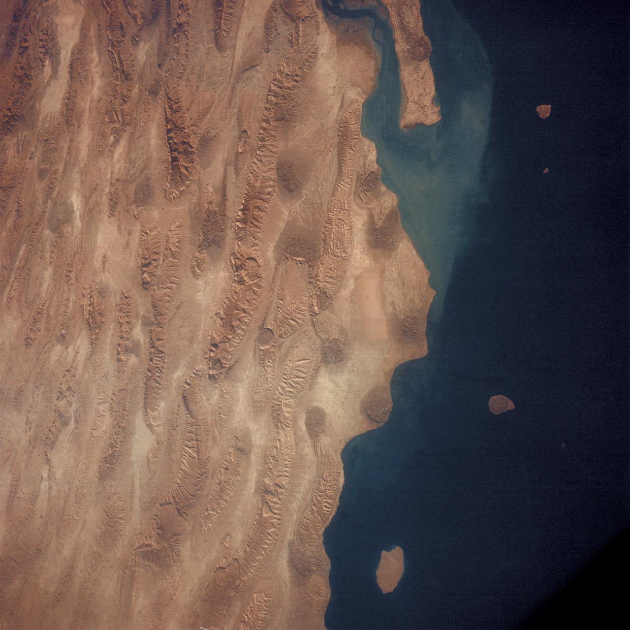 AS7-05-1615 (12 Oct. 1968) --- Persian Gulf coastal area of Iran, Qeshm Island, as seen from the Apollo 7 spacecraft during its 24th revolution of Earth. Photographed from an altitude of approximately 130 nautical miles, at ground elapsed time of 37 hours and 23 minutes.