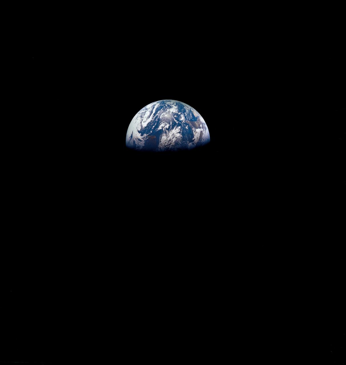 AS8-15-2561 (21-27 Dec. 1968) --- View of Earth as photographed by the Apollo 8 astronauts on their return trip from the moon. Note that the terminator is straighter than on the outbound pictures. The terminator crosses Australia. India is visible. The sun reflection is within the Indian Ocean.