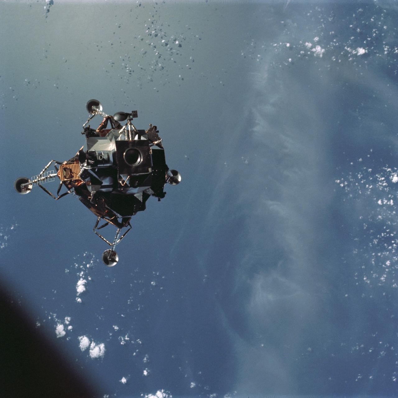 AS09-21-3181 (7 March 1969) --- A View of the Apollo 9 Lunar Module (LM), "Spider," in a lunar lading configuration, as photographed from the Command and Service Modules (CSM) on the fifth day of the Apollo 9 Earth-orbital mission. The landing gear on the "Spider" has been deployed. Inside the "Spider" were astronauts James A. McDivitt, Apollo 9 commander; and Russell L. Schweickart, lunar module pilot. Astronaut David R. Scott, command module pilot, remained at the controls in the Command Module (CM), "Gumdrop," while the other two astronauts checked out the LM.