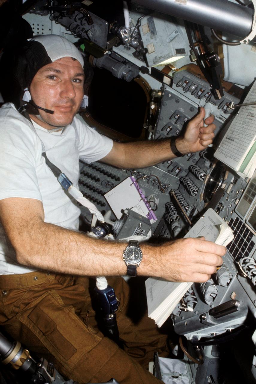 AST-08-499 (15-24 July 1975) --- Astronaut Vance D. Brand, command module pilot of the American ASTP crew, is seen at the controls of the Apollo Command Module during the joint U.S.-USSR Apollo-Soyuz Test Project docking mission in Earth orbit. This picture was taken with a 35mm camera.