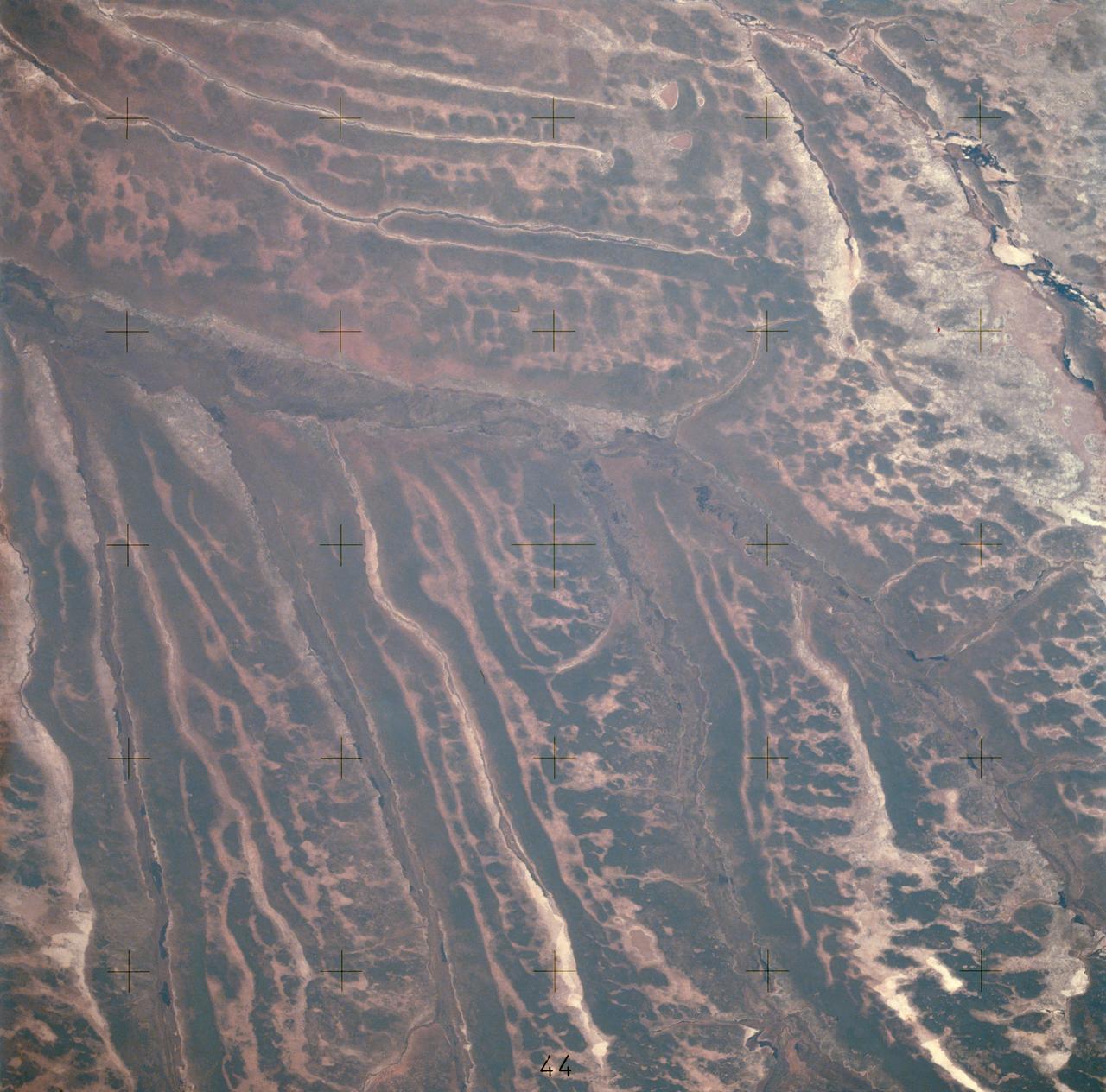 AST-14-890 (18 July 1975) --- An oblique view of unique drainage patterns in southwestern Africa in the Rio Cuando area of Angola and South-West Africa, as photographed from the Apollo spacecraft in Earth orbit during the joint U.S.-USSR Apollo-Soyuz Test Project mission. The picture was taken at an altitude of 223 kilometers (138 statute miles) with a 70mm Hasselblad camera using high-definition Ektachrome aerial SO-242 type film.