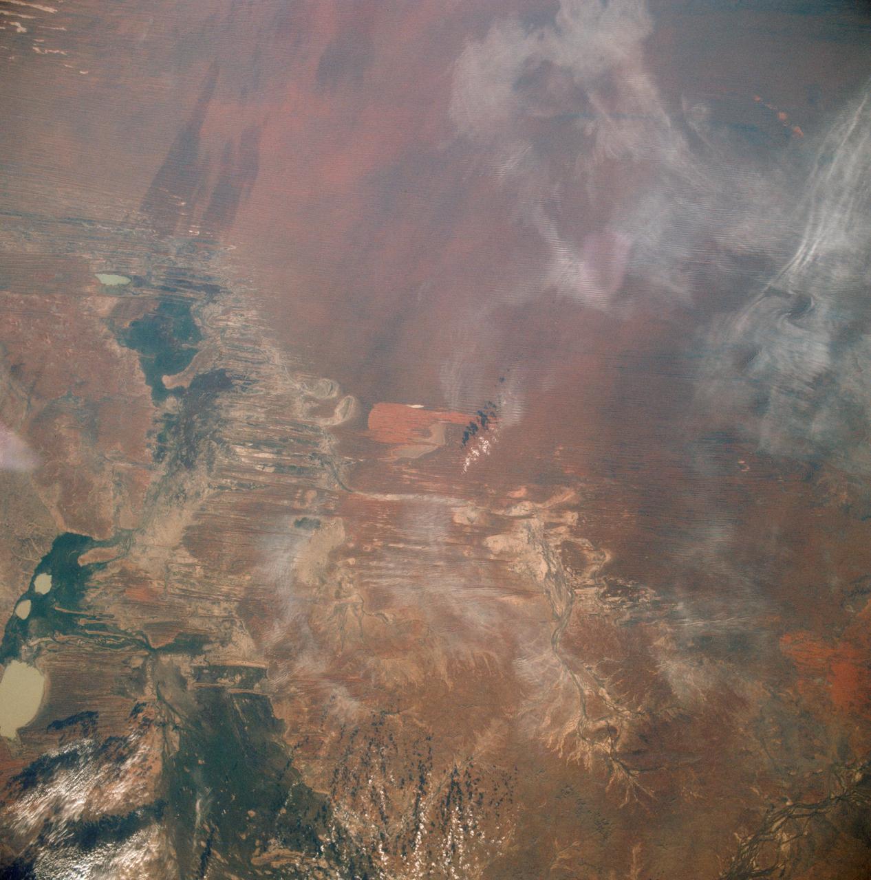 AST-19-1550 (24 July 1975) --- A vertical view of the Lake Eyre Basin area in the state of South Australia in Australia, as photographed from the Apollo spacecraft in Earth orbit during the joint U.S.-USSR Apollo-Soyuz Test Project mission. The picture was taken at an altitude of 241 kilometers (150 statute miles) with a 70mm Hasselblad camera using medium-speed Ektachrome QX-807 type film.