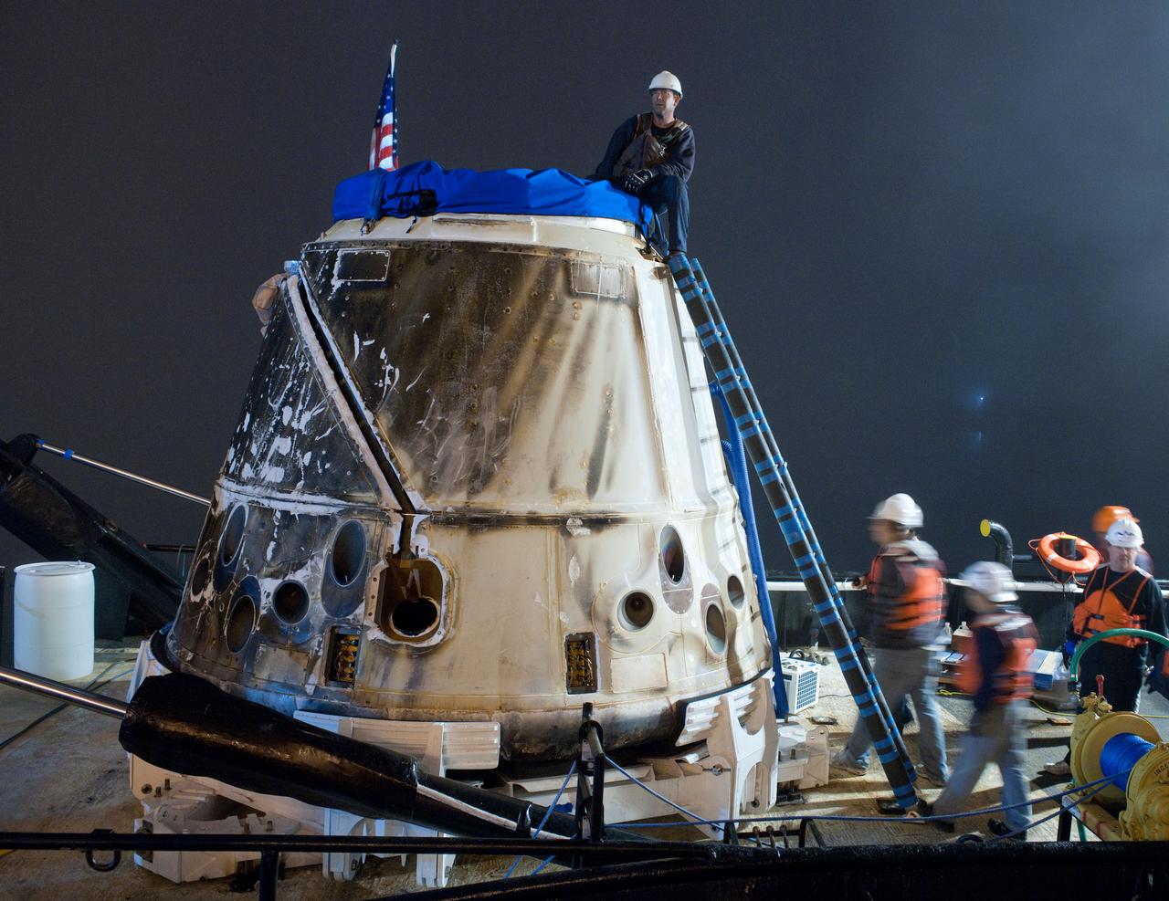 SpaceX’s Dragon capsule is seen shortly after arriving at a port near Los Angeles, Calif on Tuesday, Oct. 30, 2012. Dragon had just completed its first commercial resupply mission to the International Space Station and returned 1,673 pounds of science and supplies back to Earth.   Photo credit: NASA 