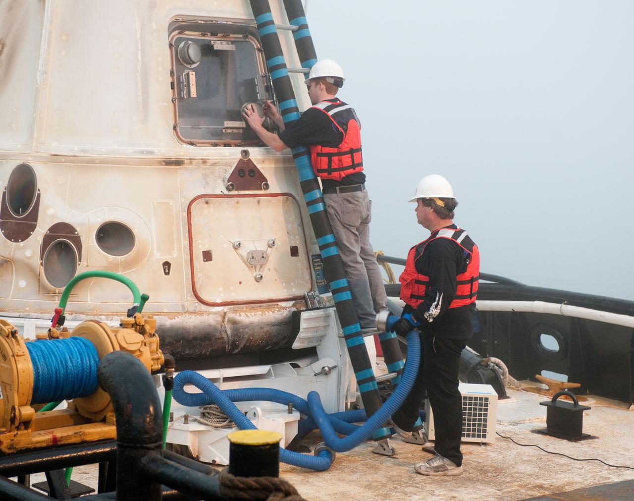 SpaceX’s Dragon capsule is seen shortly after arriving at a port near Los Angeles, Calif on Tuesday, Oct. 30, 2012. Dragon had just completed its first commercial resupply mission to the International Space Station and returned 1,673 pounds of science and supplies back to Earth.   Photo credit: NASA 