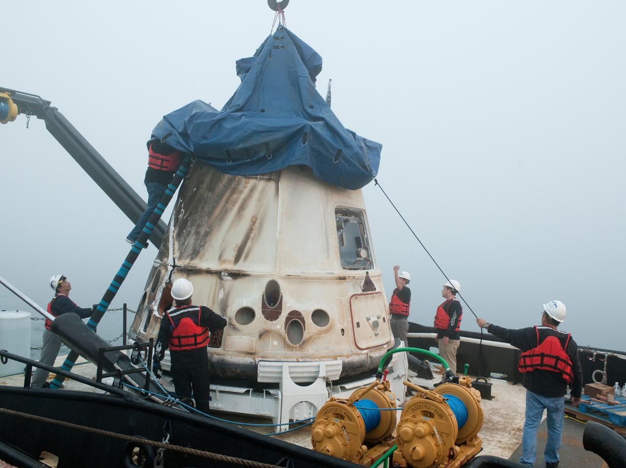 SpaceX’s Dragon capsule is seen shortly after arriving at a port near Los Angeles, Calif on Tuesday, Oct. 30, 2012. Dragon had just completed its first commercial resupply mission to the International Space Station and returned 1,673 pounds of science and supplies back to Earth.   Photo credit: NASA 