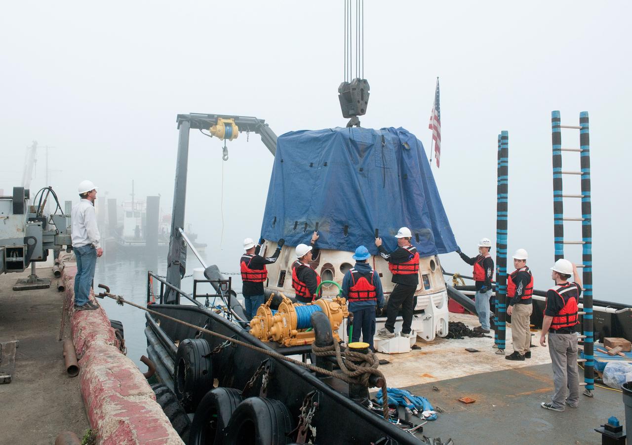 SpaceX’s Dragon capsule is seen shortly after arriving at a port near Los Angeles, Calif on Tuesday, Oct. 30, 2012. Dragon had just completed its first commercial resupply mission to the International Space Station and returned 1,673 pounds of science and supplies back to Earth.   Photo credit: NASA 