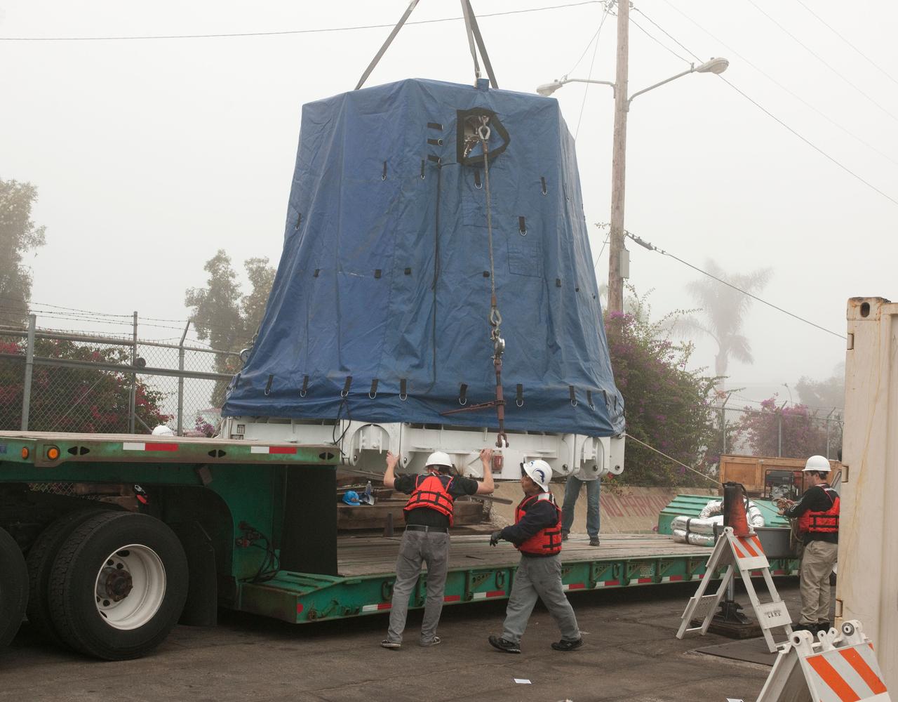SpaceX’s Dragon capsule is seen shortly after arriving at a port near Los Angeles, Calif on Tuesday, Oct. 30, 2012. Dragon had just completed its first commercial resupply mission to the International Space Station and returned 1,673 pounds of science and supplies back to Earth.   Photo credit: NASA 
