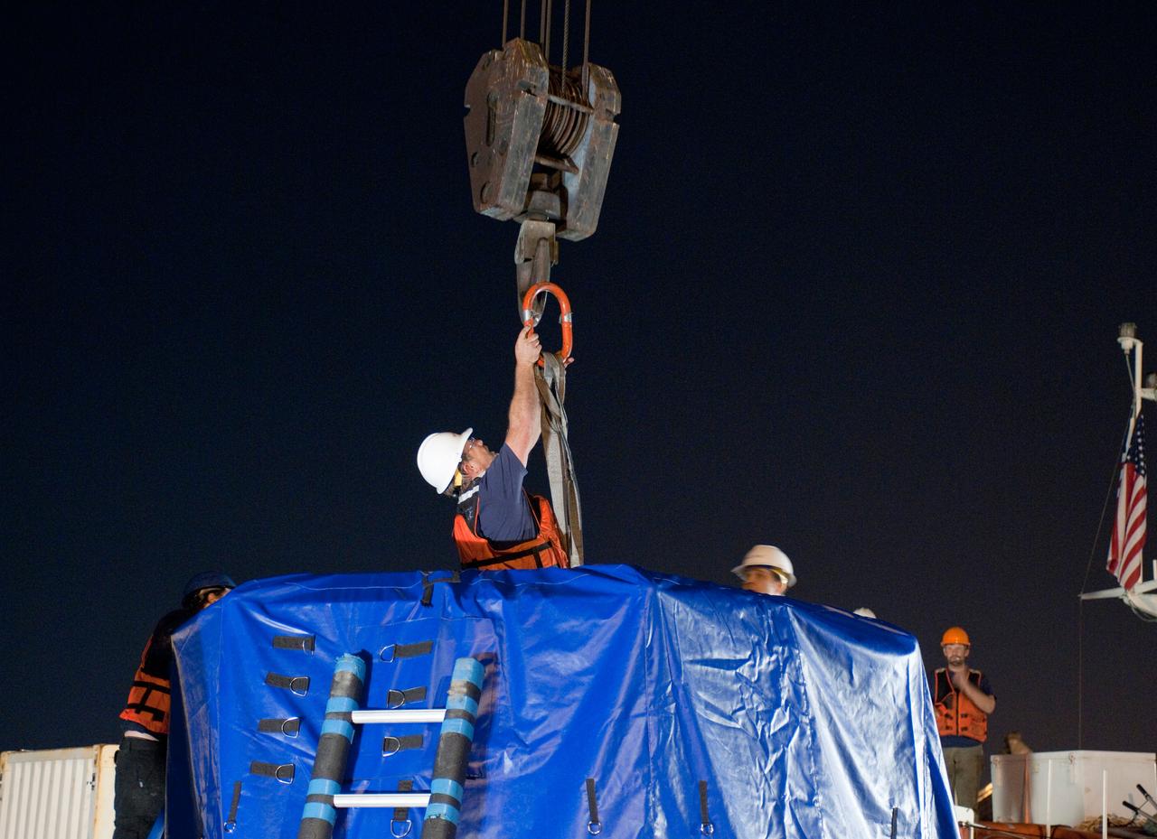 ED13-0079-14 (26 March 2013) ---- SpaceX Dragon's second operational mission ended  on March 26 after three weeks attached to the International Space Station. The unmanned spacecraft splashed down  in the Pacific Ocean about 214 miles off the coast of Baja California to successfully return about 2,670 pounds of science materials from the orbital outpost.  Photo credit:  NASA