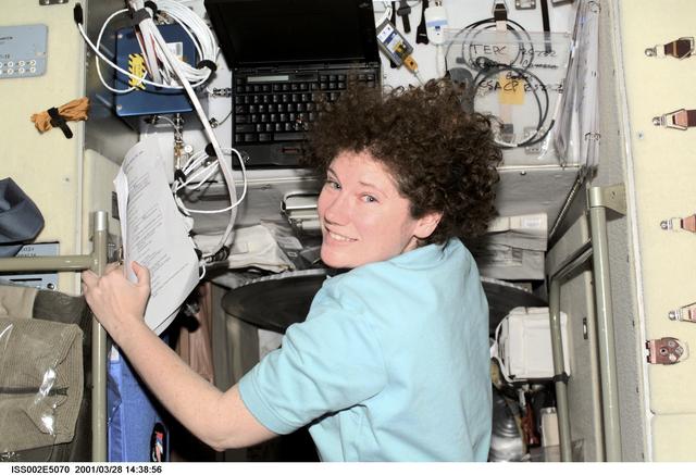 NASA image: Helms in Service Module with computer