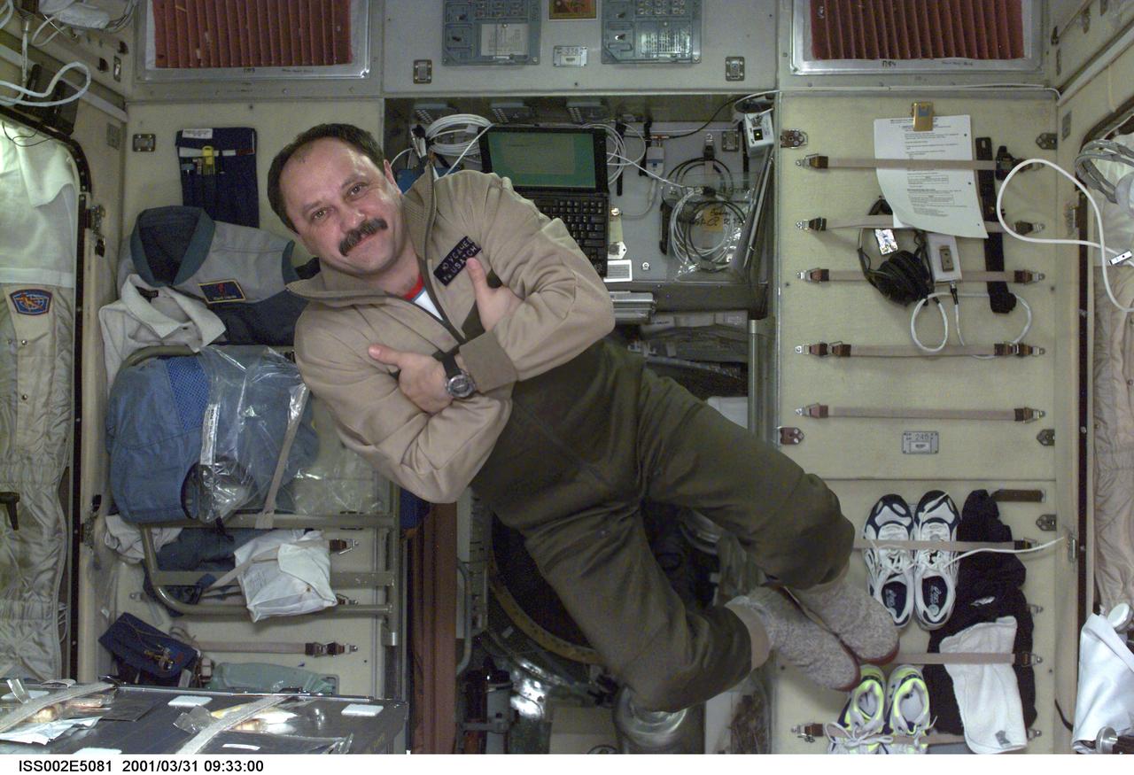 ISS002-E-5081 (31 March 2001) --- Cosmonaut Yury V. Usachev, Expedition Two commander, floats in the Zvezda Service Module onboard the International  Space Station (ISS).  Usachev, representing Rosaviakosmos, and two American astronauts recently replaced the Expedition One crew on the orbital outpost after that threesome had been onboard since early November 2000.  The image was recorded with digital still camera.