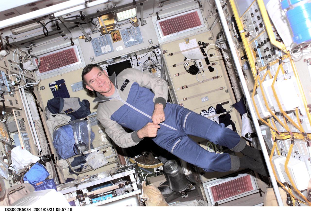 ISS002-E-5084 (31 March 2001) --- Astronaut James S. Voss, Expedition Two flight engineer, floats in the Zvezda Service Module onboard the International Space Station (ISS).  Voss, along with astronaut Susan J. Helms and  cosmonaut Yury V. Usachev of Rosaviakosmos, recently replaced the  initial three-member crew onboard the orbital outpost.  The image was taken with a digital still camera.