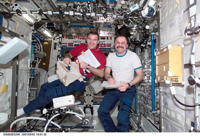 NASA image: Voss unpacks stowage bags in Destiny module