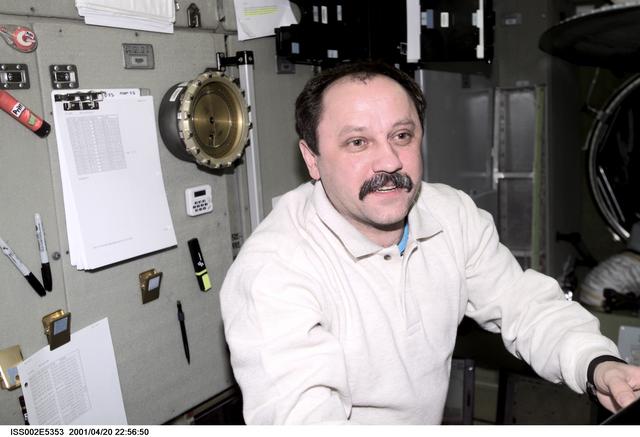 NASA image: Portrait view of Usachev with checklist in Service Module