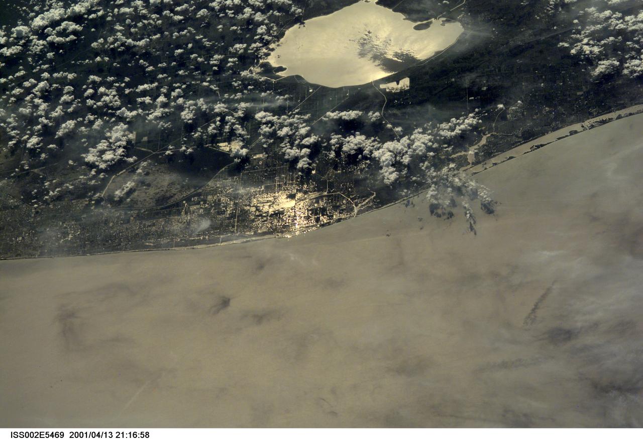 ISS002-E-5469 (13 April 2001) --- The Atlantic Coast of parts of southern Florida was captured with a digital still camera by one of the Expedition Two crew members aboard the International Space Station (ISS).  Among recognizable points are Palm Beach, West Palm Beach (near center frame), the Indian River (near the coast) and Lake Okeechobee (top center).  This was one of a series of images of southern Florida that were  captured by the Expedition Two crew on April 13, 2001.