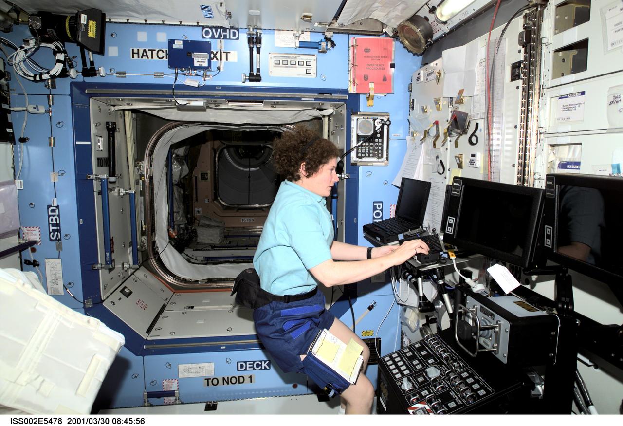 ISS002-E-5478 (30 March 2001) --- Astronaut Susan J. Helms, Expedition Two flight engineer, works at a laptop computer in the U.S. Laboratory / Destiny module of the International Space Station (ISS). The Space Station Remote Manipulator System (SSRMS) control panel is visible to Helms' right. This image was recorded with a digital still camera.