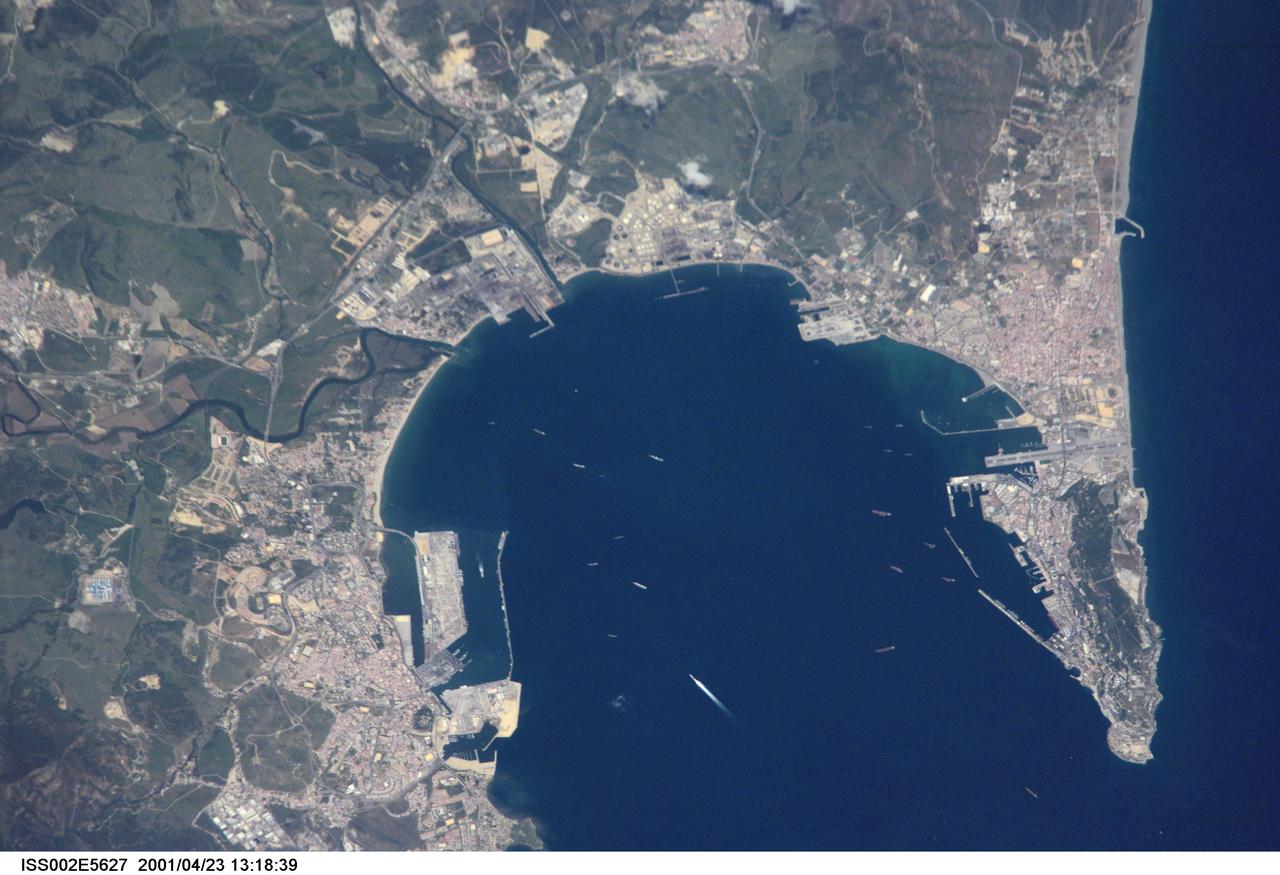 ISS002-E-5627 (23 April 2001) --- Algecira (left), the Bay of Gibraltar (Bahia de Algecira) and &quot;The Rock of Gibraltar&quot; (right) are featured in this detailed vertical view on the European side of the Strait of Gibraltar. Ship traffic in the Bay and Gibraltar Dock Yard can easily be seen. This digital still camera's image is part of a series of pictures centering on the Strait of Gibraltar area which was recorded by the ISS Expedition Two crew on April 23, 2001.