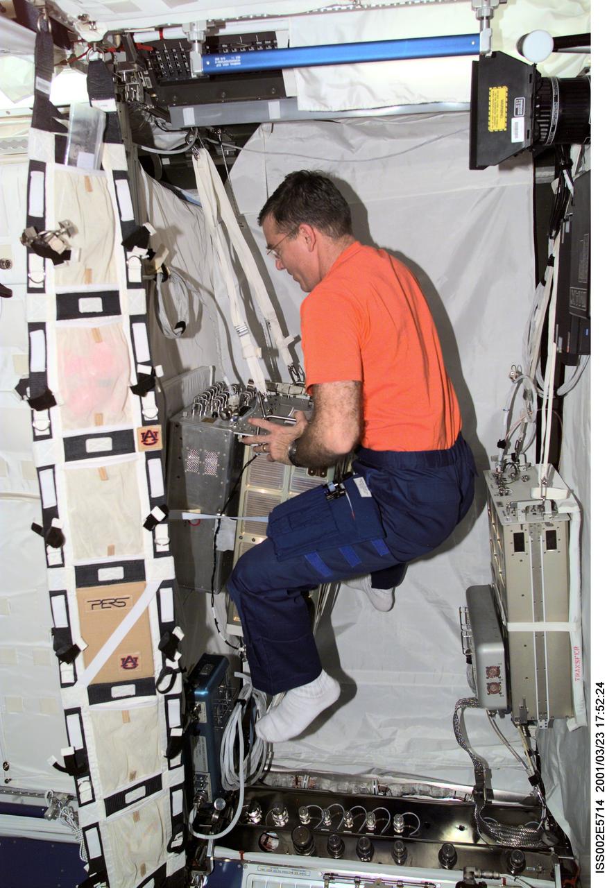 ISS002-E-5714 (23 March 2001) --- Astronaut James S. Voss, Expedition Two flight engineer, sets up the Bonner Ball Neutron Detector (BBND) in the Destiny laboratory.  The BBND is connected to the Human Research Facility (HRF). This image was recorded with a digital still camera.
