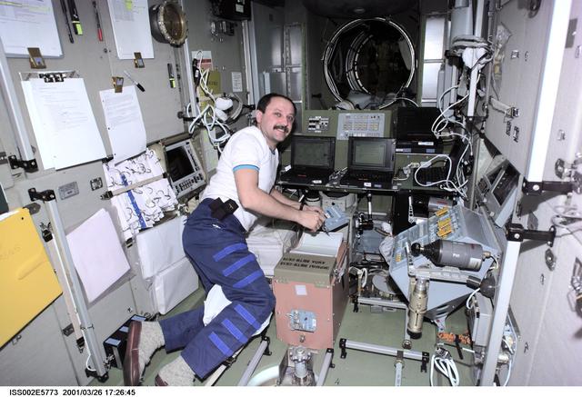 NASA image: Usachev takes notes in Service Module