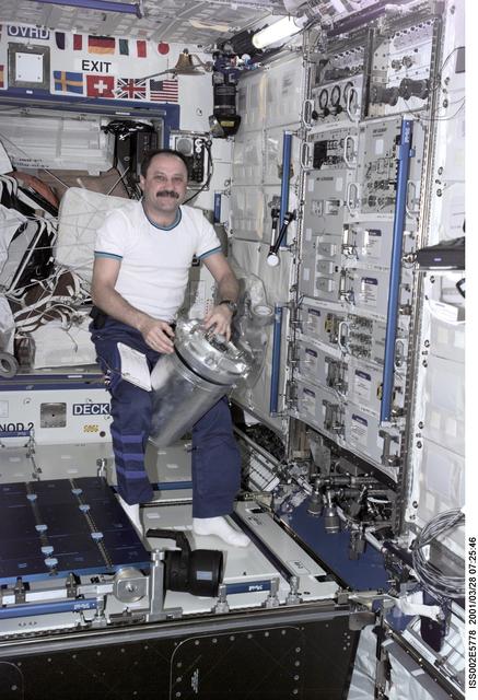 NASA image: Usachev with water transfer container in Destiny module