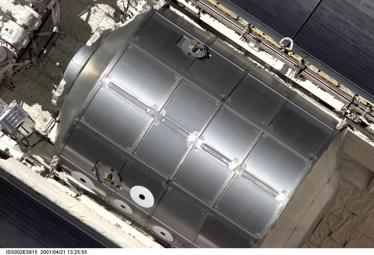 ISS002-E-5815 (21 April 2001) --- The Raffaello Multi-Purpose Logistics Module (MPLM), built by the Italian Space Agency (ASI), sits in its berthed position in the cargo bay of the Space Shuttle Endeavour as the STS-100 crew eases the vehicle close to the International Space Station (ISS) for docking.  The image was recorded with a digital still camera by one of the Expedition Two crew members aboard the Station.