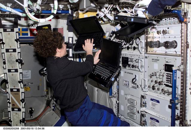 NASA image: Helms with computers at HRF rack in Destiny module