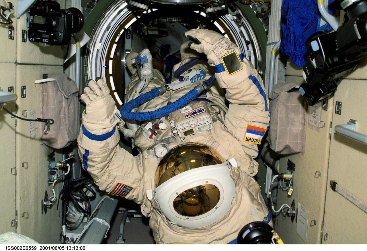 ISS002-E-6559 (5 June 2001) --- View of Russian Orlan space suits drifting in the Zarya module of the International Space Station (ISS).  These Orlan spacesuits were used by Yury V. Usachev of Rosaviakosmos, Expedition Two mission commander, and James S. Voss, Expedition Two flight engineer, for their June 8, 2001, space walk.  The image was recorded with a digital still camera.