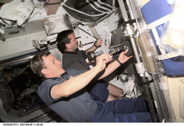 NASA image: STS-100 MS Parazynski and Hadfield with IRED equipment in Node 1/Unity module