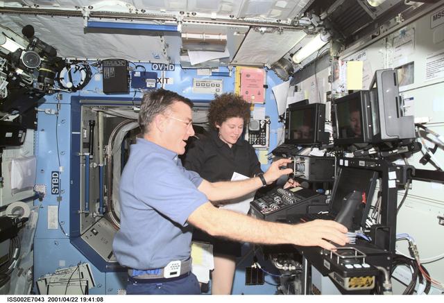 NASA image: Voss and Helms at SSRMS controls in Destiny laboratory module