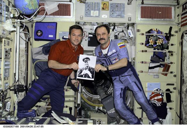 NASA image: Usachev and Lonchakov in Service module with picture of Gagarin