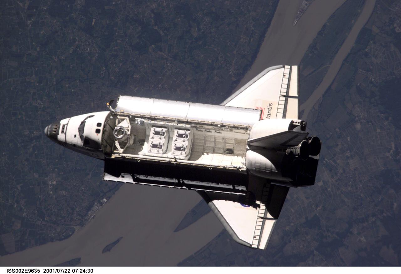 ISS002-E-9635 (21 July 2001) --- View of the Space Shuttle Atlantis after it undocked from the International Space Station (ISS) during the STS-104 mission. The STS-104 crew delivered the Quest Airlock to the ISS during the twelve day mission. This image was recorded by an Expedition Two crew member with a digital still camera.
