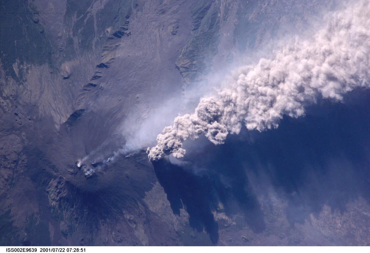 ISS002-E-9639 (22 July 2001) --- An overhead look at the smoke and ash being expelled from the erupting volcano Mt. Etna on the island of Sicily.  This image was recorded by an Expedition Two crew member with a digital still camera.