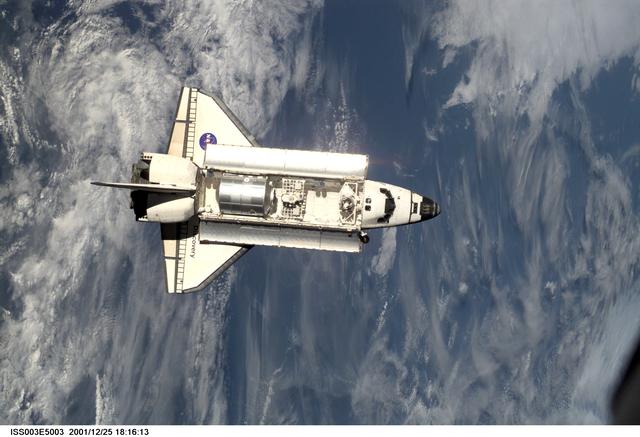 NASA image: View of Discovery approaching the ISS for docking during the STS-105 mission