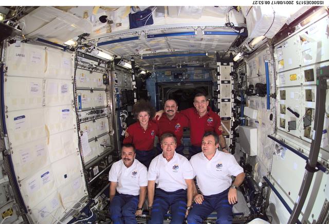 NASA image: Expedition Three and Expedition Two crews pose in the U.S. Laboratory