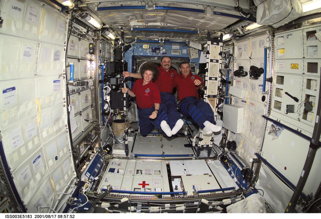 ISS003-E-5183 (17 August 2001) --- The Expedition Two crew members pause from their daily activities to pose for a group photo in the Destiny laboratory while visiting the International Space Station (ISS). From left to right are, astronaut Susan J. Helms, flight engineer, cosmonaut Yury V. Usachev, mission commander, and astronaut James S. Voss, flight engineer. Usachev represents Rosaviakosmos. This image was taken with a digital still camera.