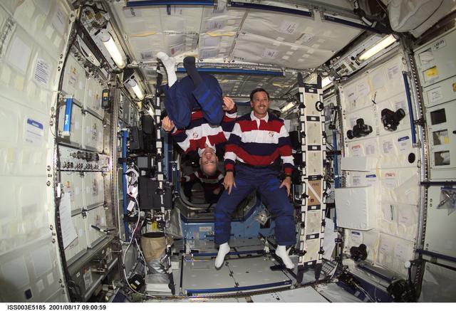 NASA image: STS-105 MS Barry and Commander Horowitz pose in the U.S. Laboratory