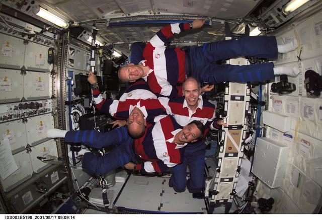 NASA image: STS-105 crewmembers pose for their group photo in the U.S. Laboratory