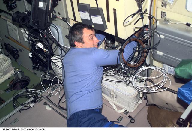 NASA image: Dezhurov works with electronic equipment in Zvezda during Expedition Three