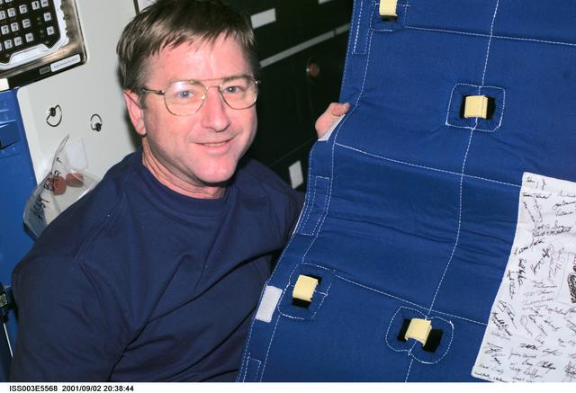 NASA image: Culbertson sets up the Temporary Sleep Station (TESS) in Destiny during Expedition Three